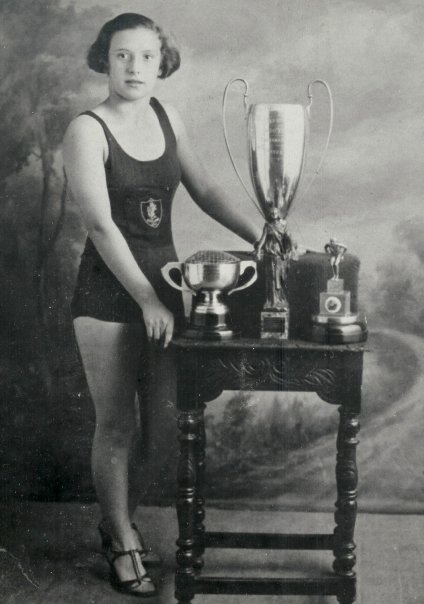 Beatrice Wolstenholme with swimming trophies c1932